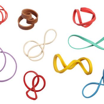 Twisted colorful elastic rubber bands isolated on white background